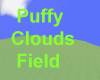 puffy clouds field