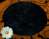 Round black fur rug