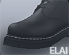 E. Black Boots