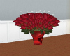Roses in red heart vase