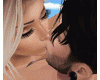 Couple Laying Kiss