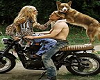 COUPLE ON BIKE WITH DOG