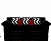 Black couch red pillows