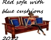 Red sofa blue cushions