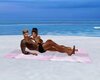 beach towel couple pose
