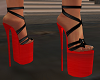 She Strapped Red Bottoms