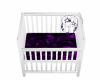 purple and white crib
